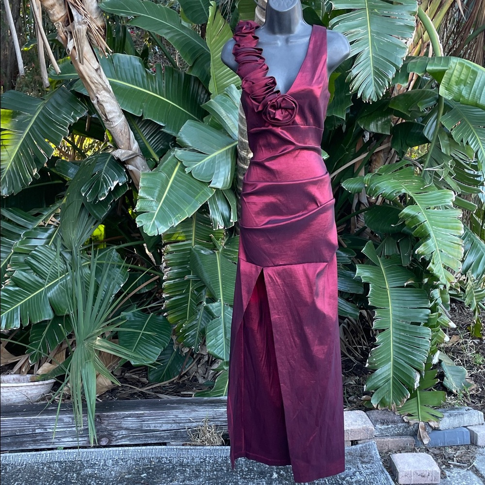 Burgundy red ruffled metallic gown with front slit